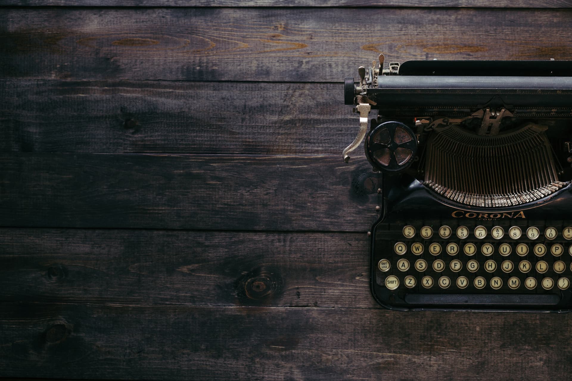 Antique typewriter on dark wood
