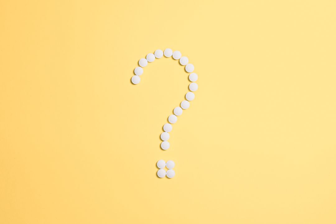 Question mark composed with dots on yellow background