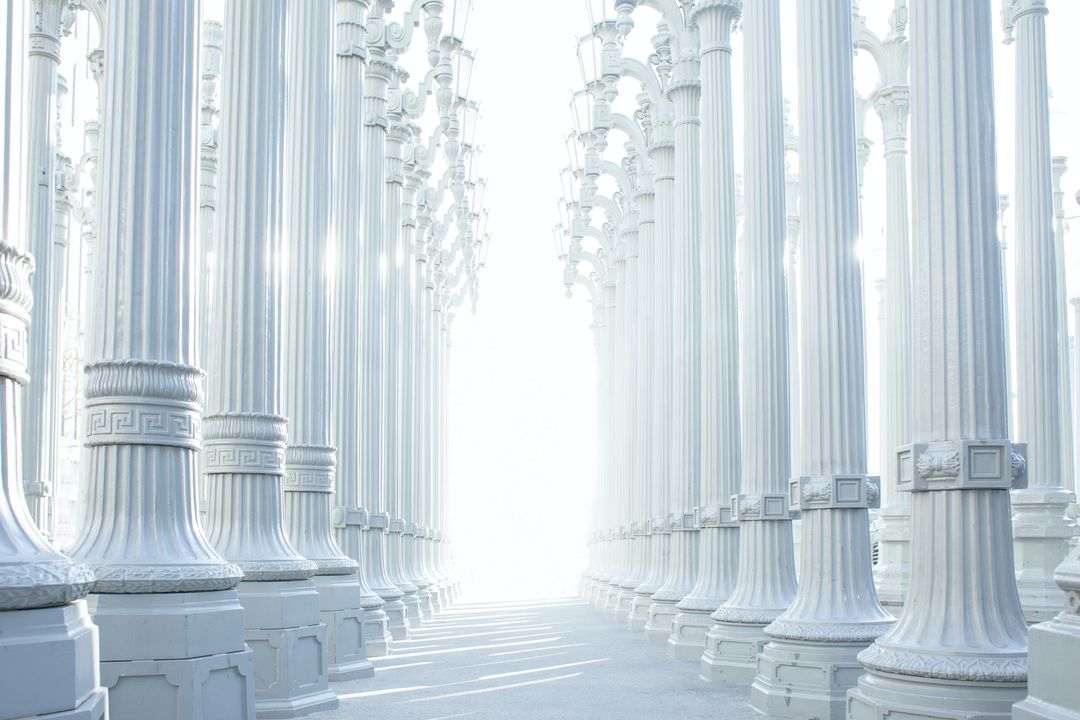 Many white pillars in two rows